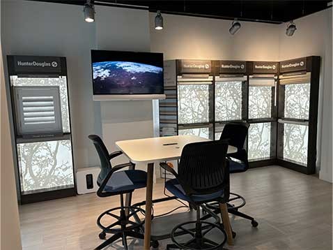 Store interior showcasing several different types of window coverings